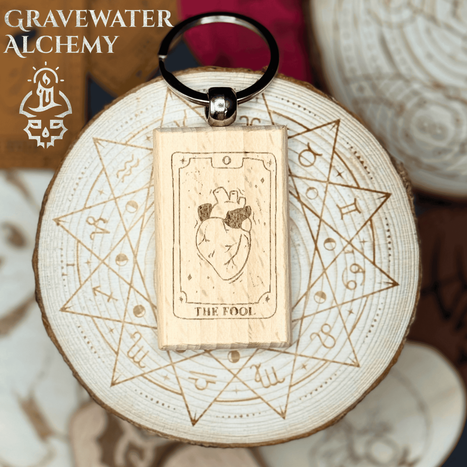 Wooden engraved Tarot keychain featuring The Fool design with anatomical heart by Gravewater Alchemy.