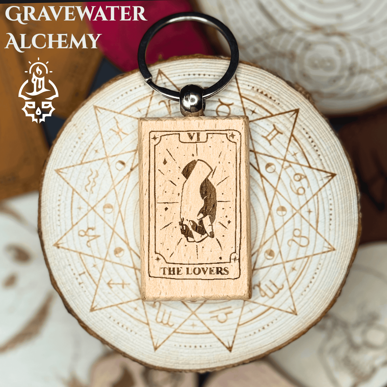 Engraved wooden Tarot keychain featuring The Lovers design of two clasped hands by Gravewater Alchemy.