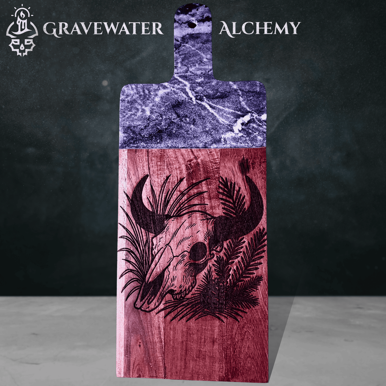 Engraved acacia marble serving board with skull design by Gravewater Alchemy