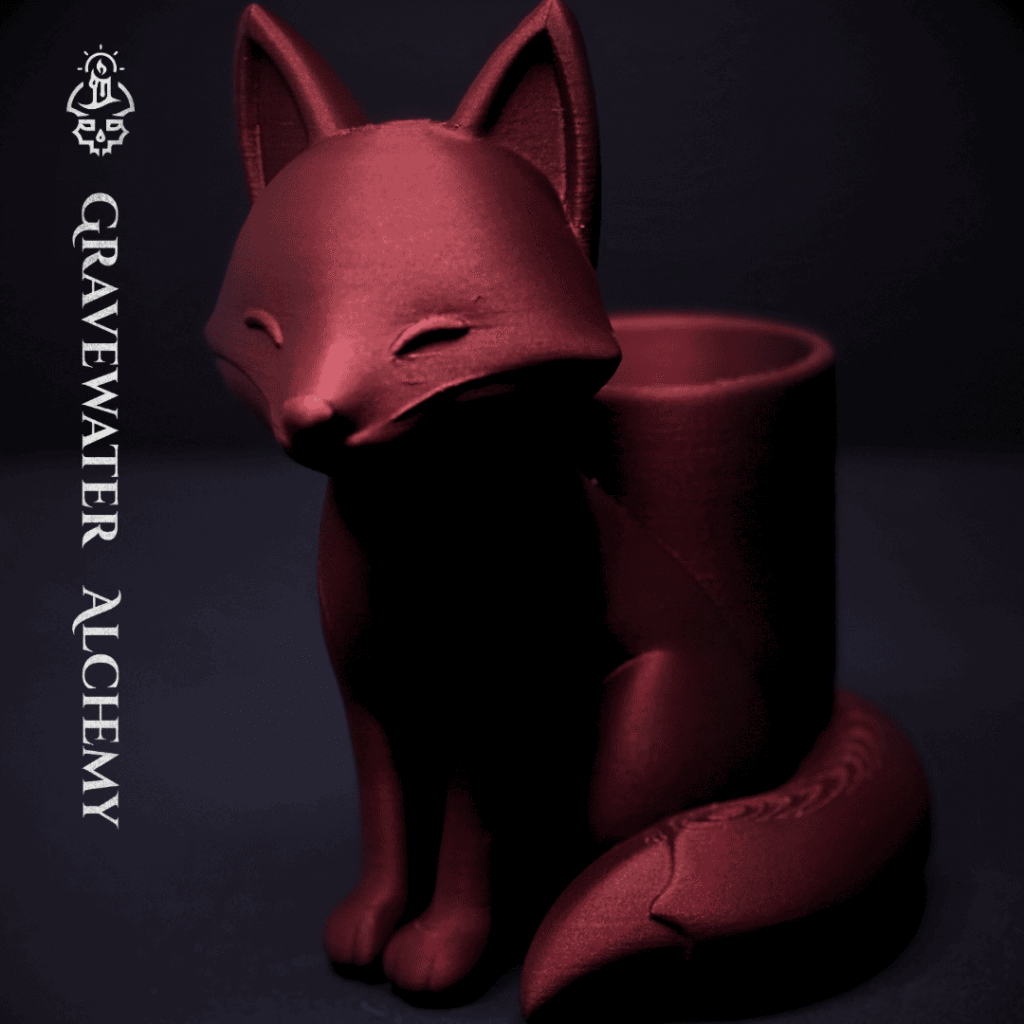 Bronze fox pen holder with closed eyes in a seated pose by Gravewater Alchemy